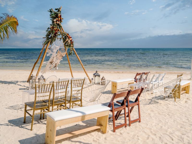A Beach With Chairs And Tables