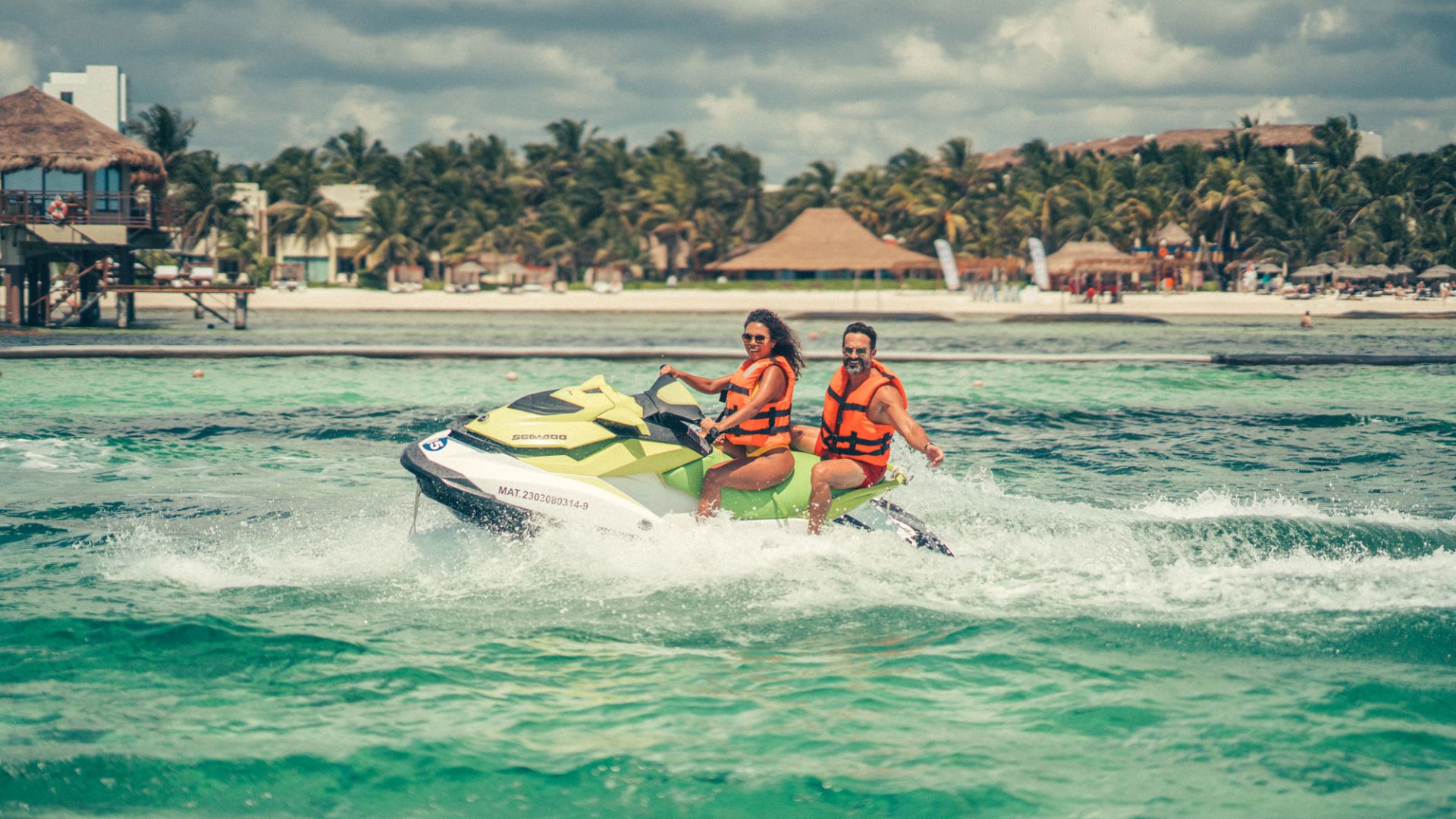 A Group Of People Riding A Jet Ski On The Water